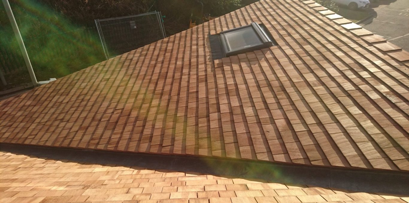 Cedar roof tiles fitted around velux window